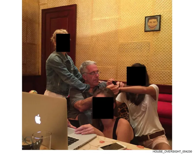 Epstein appears with several women whose identities have been obscured in this image released by Democrats on the House Oversight Committee on December 18, 2025 [Handout/House Oversight Committee Democrats via Reuters]
